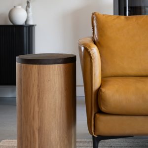 Round Side Table with Hidden Storage and Coffee Shell Finish Round side table with removable coffee shell top revealing hidden storage compartment with fabric interior