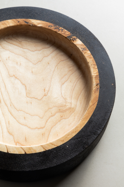 Round wooden bowl with coffee ground texture