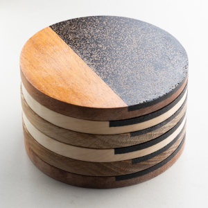 Close-up Detail of Coffee Shell Texture on Sustainable Coasters Detailed side view of stacked coasters showing coffee shell texture made from reclaimed coffee grounds